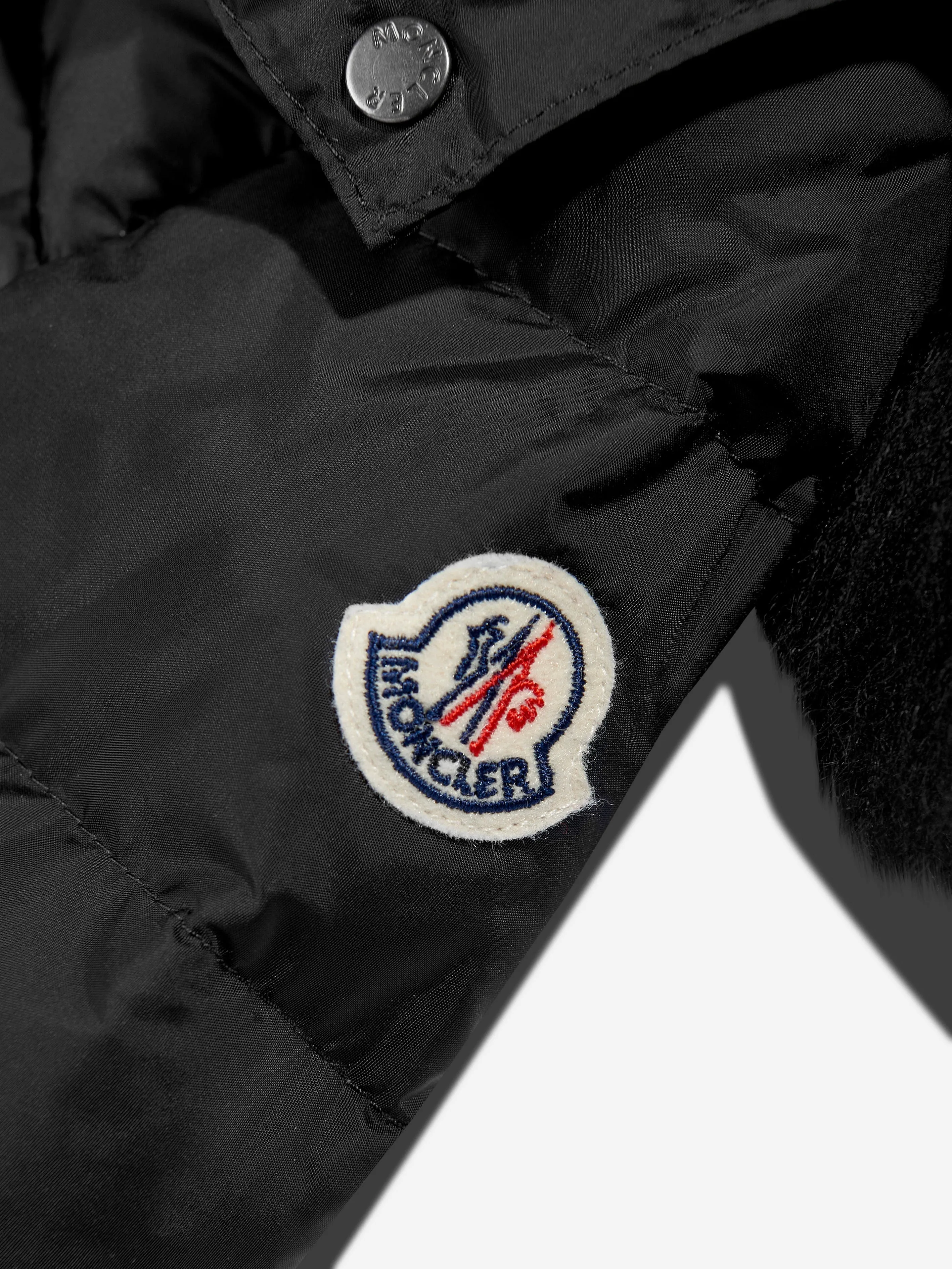 Moncler Enfant Veste en duvet à capuche doublée de shearling pour filles en noir